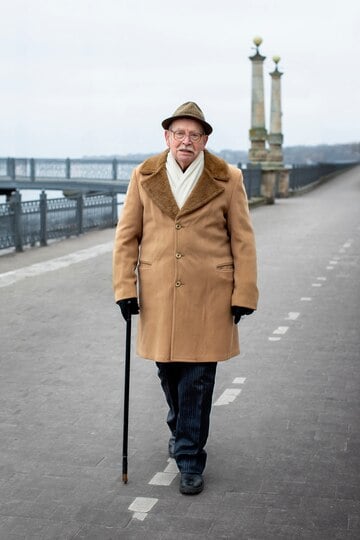 full-shot-elderly-man-taking-stroll_23-2150168231
